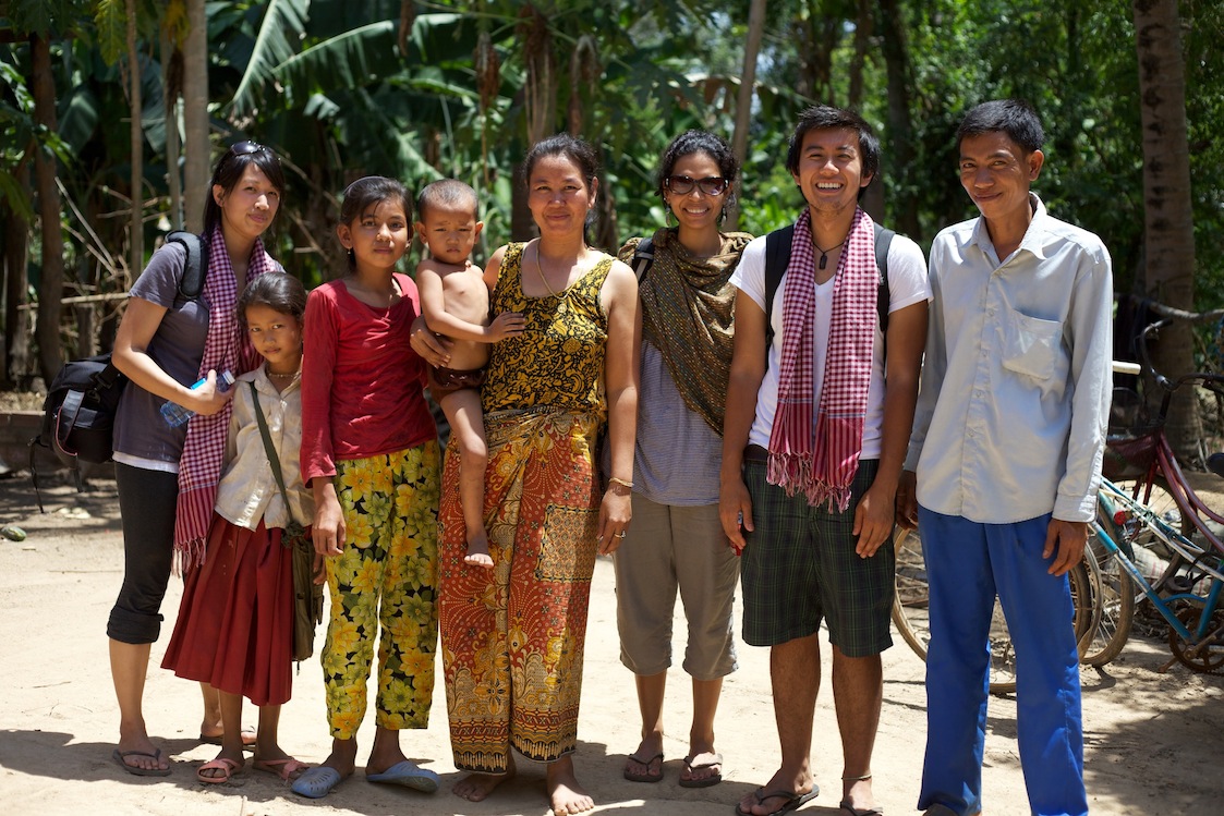 Interns from the AJA J.A.M program and Co-Founder Vinita with villagers in Kampang commune.